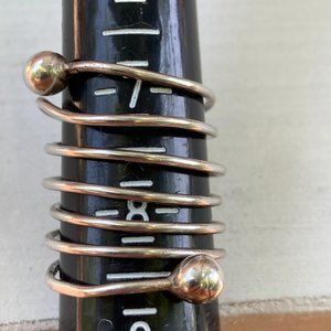 Sold.  Long thin wrap-around sterling silver ring sterling balls at both ends